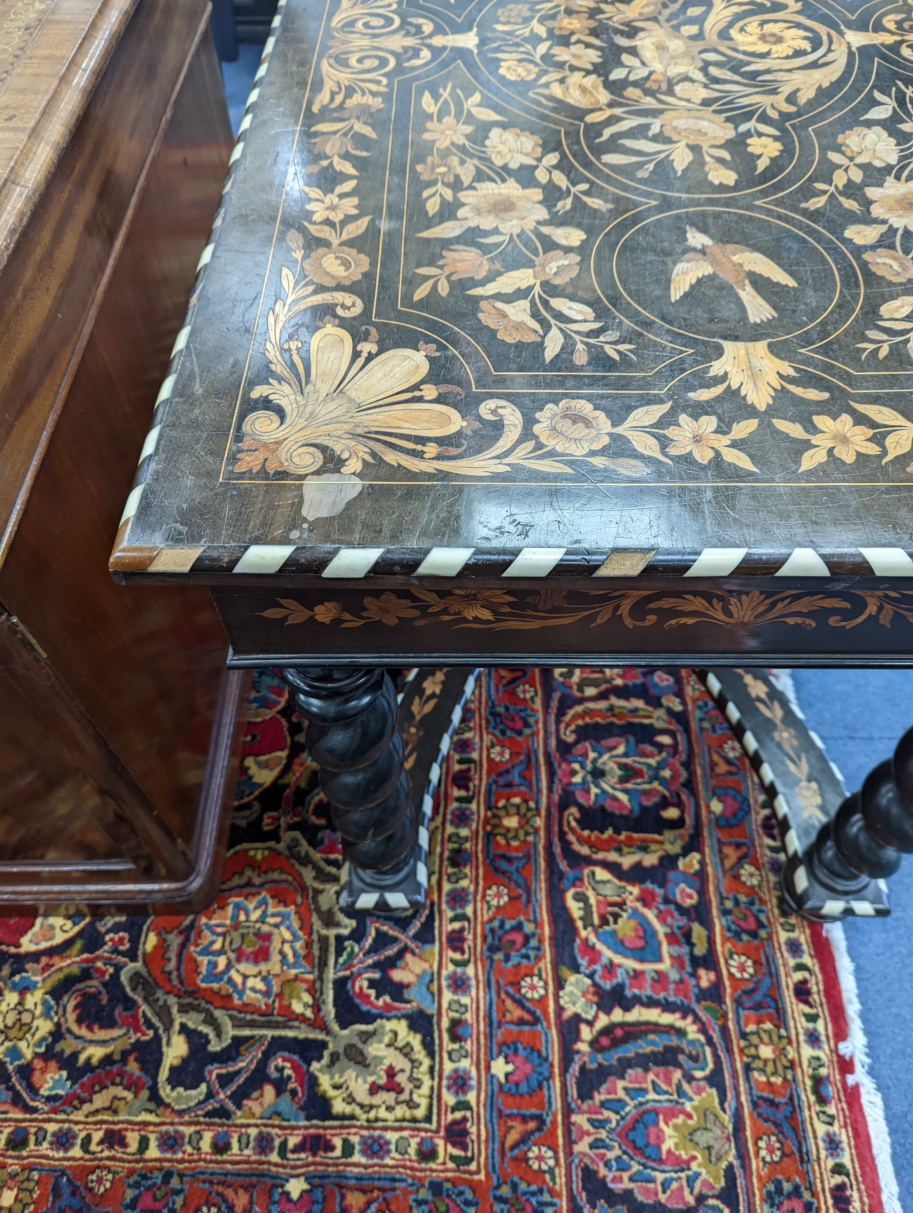 A William and Mary style rectangular marquetry and bone inlaid walnut side table, fitted drawer on ebonised spiral turned under frame with shaped X stretcher width 110cm, depth 67cm, height 78cm